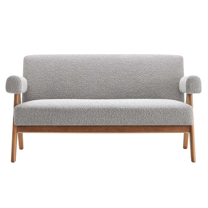 Light gray boucle two-seat sofa with wooden tapered legs and rounded armrests, mid-century modern living room seating.
