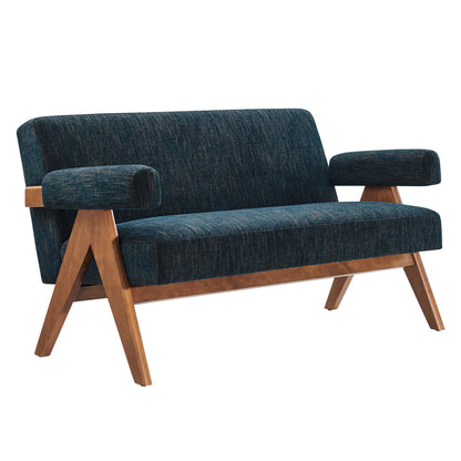 Mid-century blue upholstered loveseat with exposed angled wood legs and cushioned armrests.