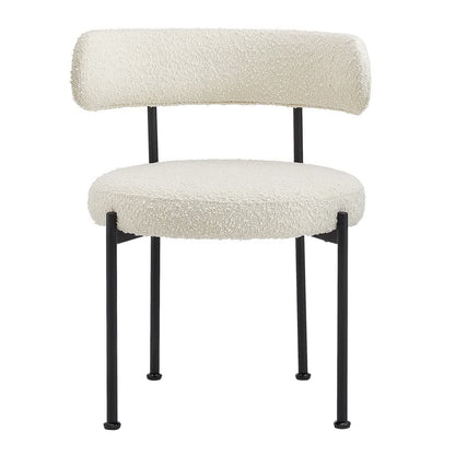 Ivory boucle upholstered dining chair with rounded fluffy seat, curved backrest and black metal legs.
