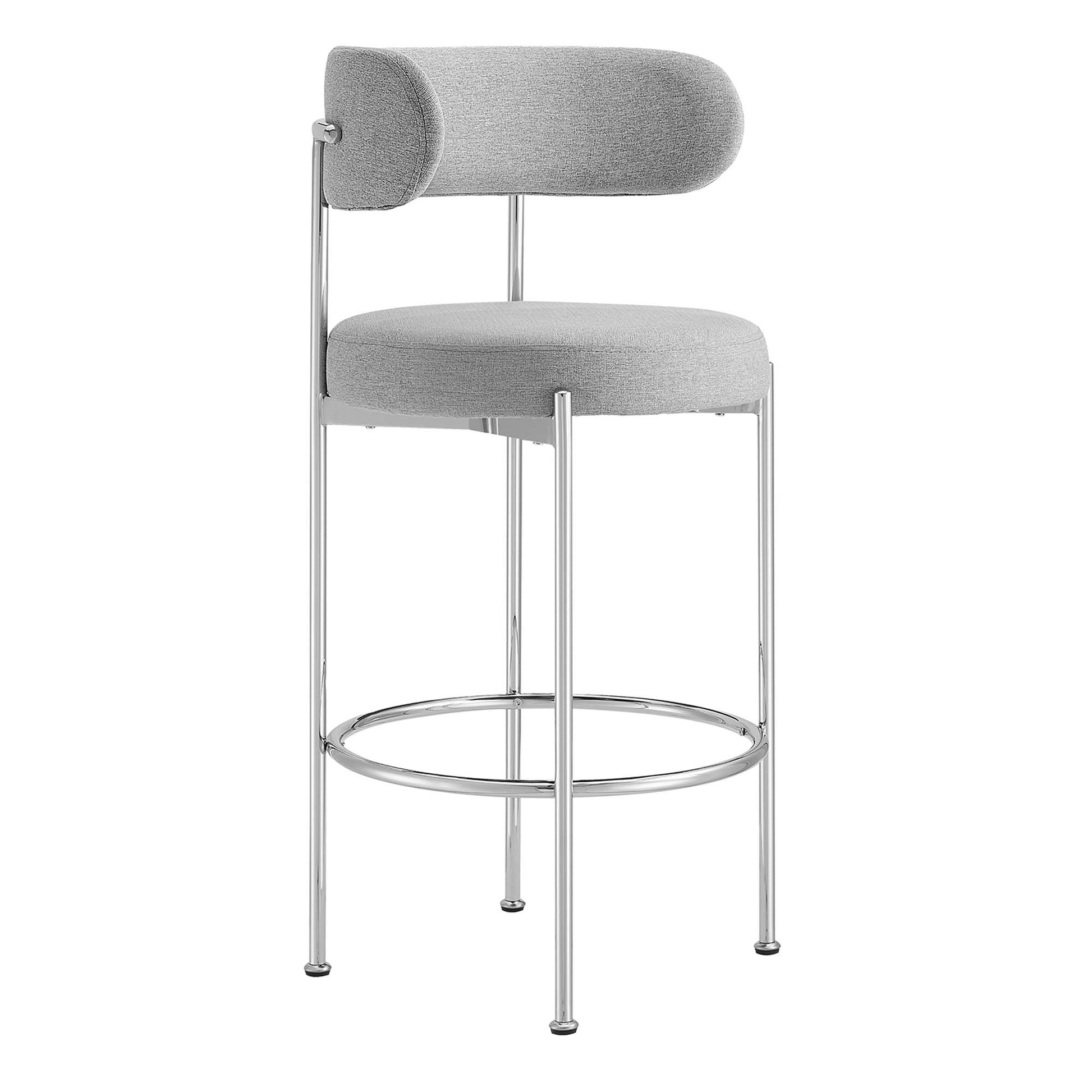 Grey upholstered bar stools with chrome frame, rounded seats, cylindrical backrests and circular footrests.