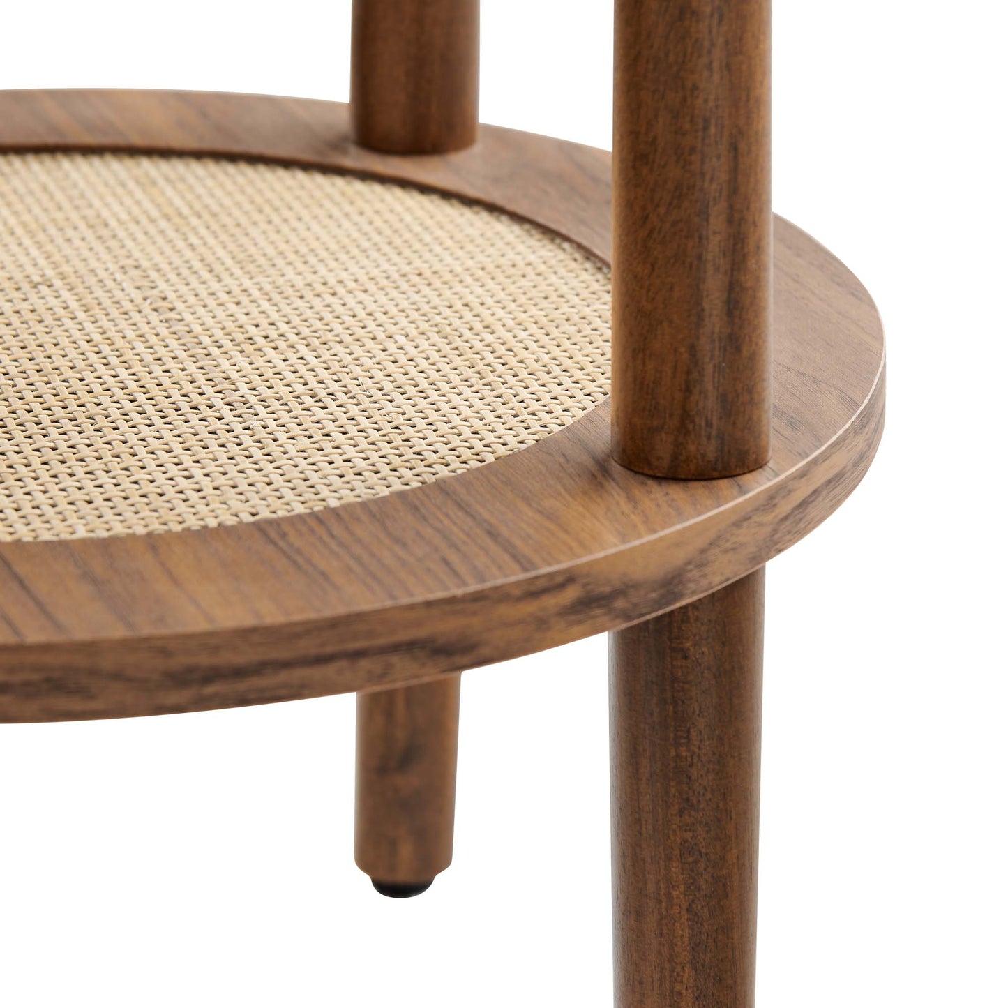 Walnut-finish round wooden side table with a cane-woven shelf and cylindrical legs.