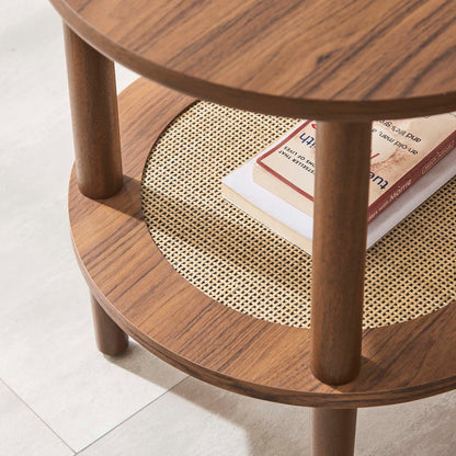 Walnut round three-tier side table with woven cane middle shelf and books.