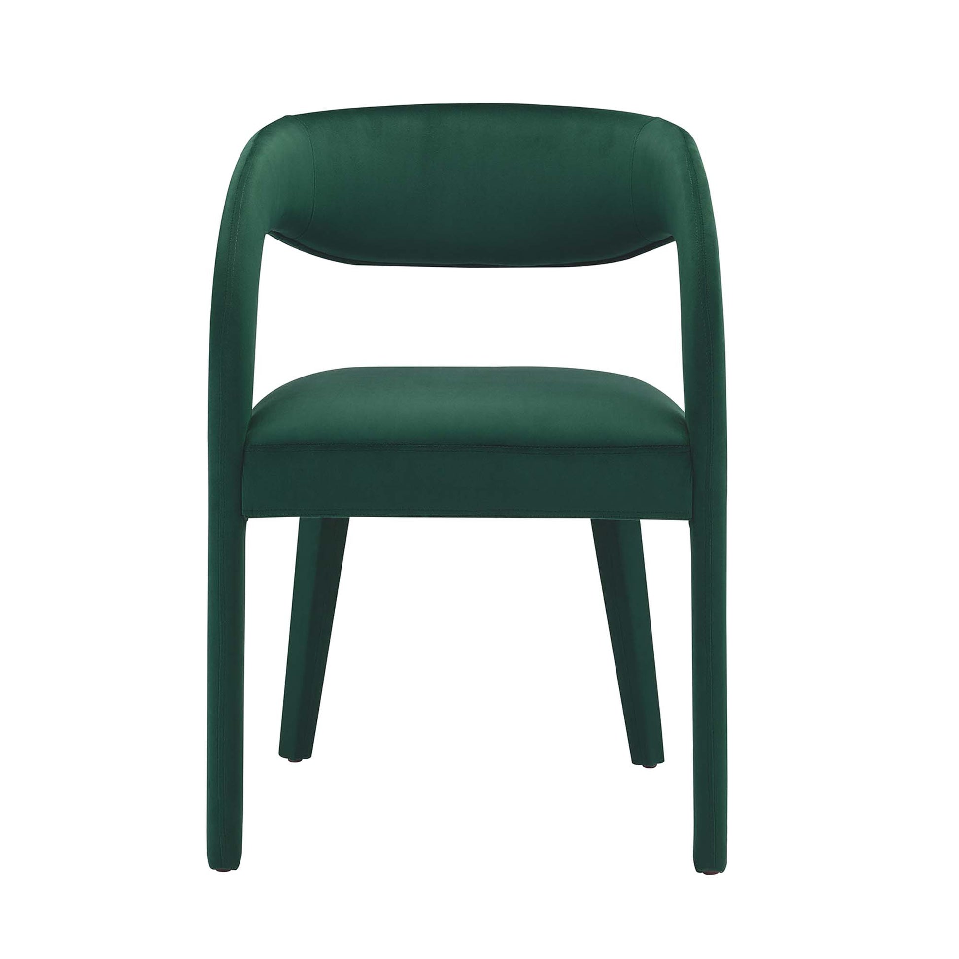 Emerald green velvet upholstered dining chair with rounded back and integrated arms, cushioned seat, modern design.