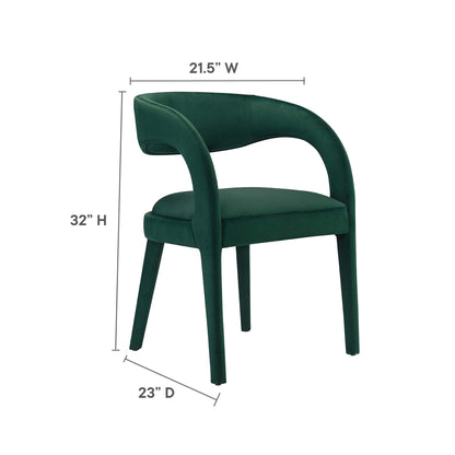 Green velvet upholstered dining chair with curved back and armrests, four legs; 21.5W x 32H x 23D.