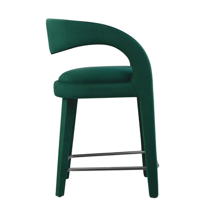 Emerald green upholstered curved-back counter stool with metal footrest, modern velvet seating for kitchen counter height