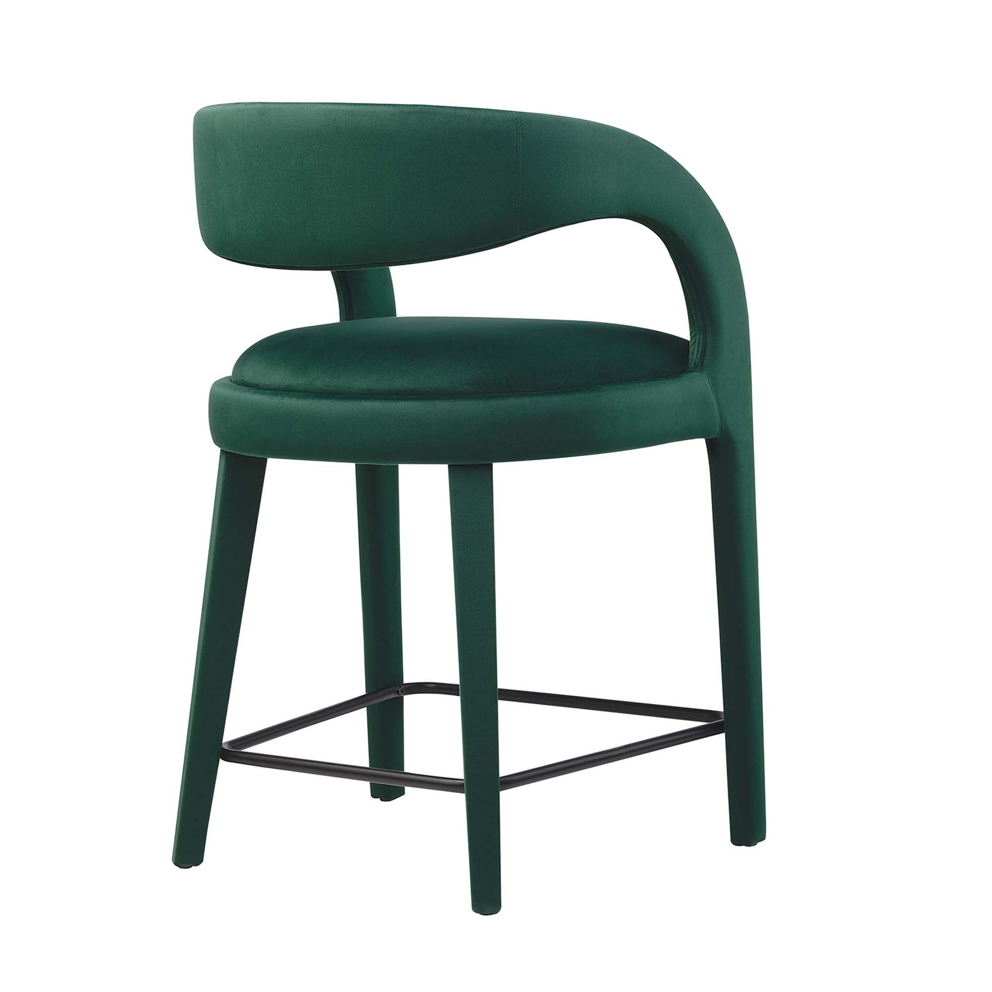 Emerald-green velvet counter stools with curved backs, round cushioned seats, and black metal footrests.