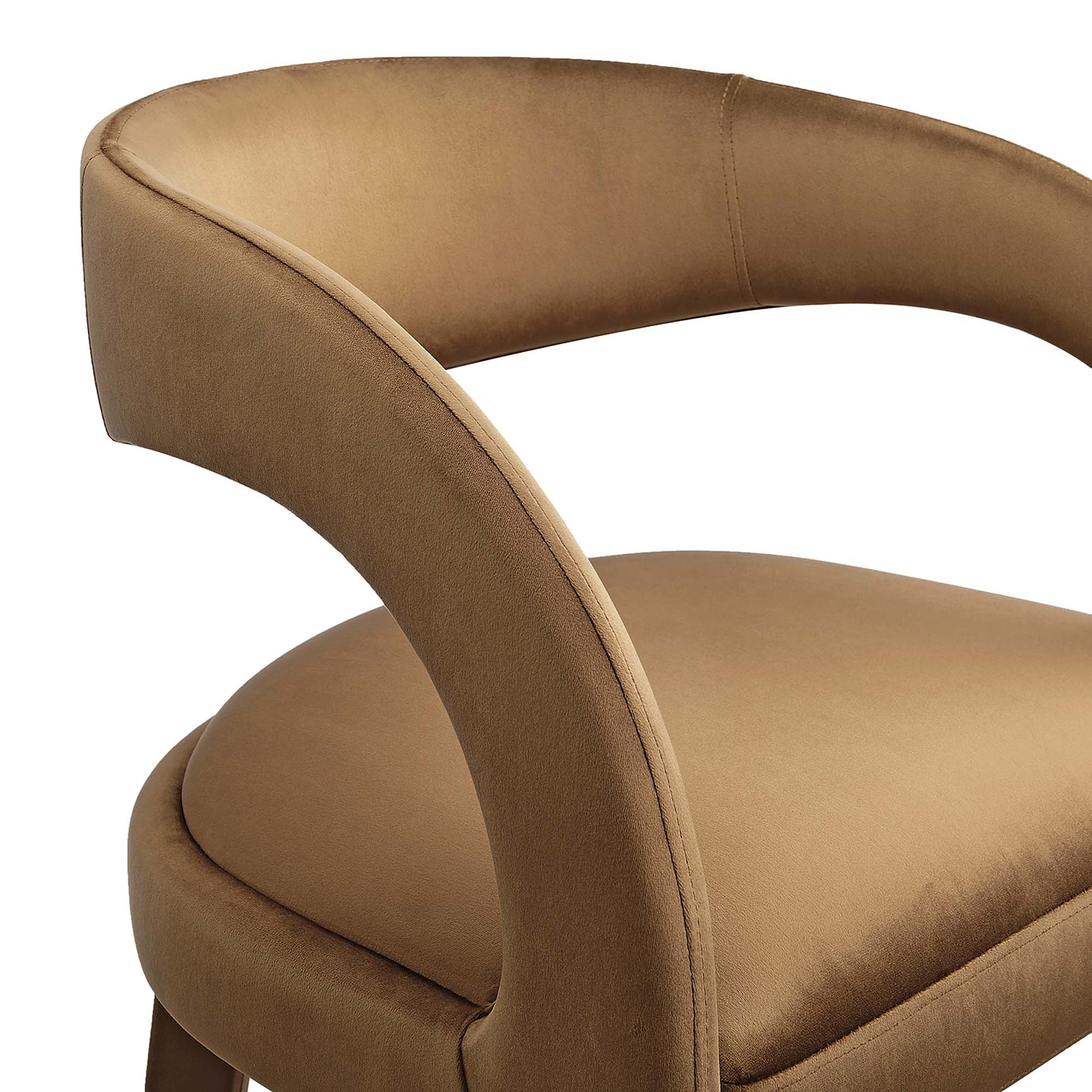 Tan velvet curved bar stool with rounded back and arched armrest, plush seat.