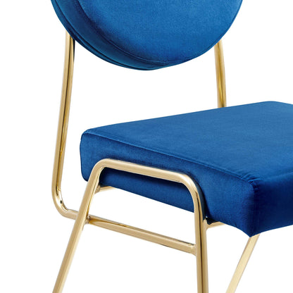 Navy blue velvet dining side chairs (set of 2) with circular backrests and gold metal frames; plush upholstered seats.