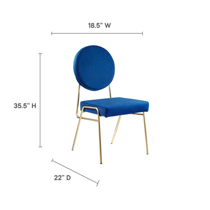 Pair of navy velvet dining chairs with round back and gold metal legs in a modern glam style.