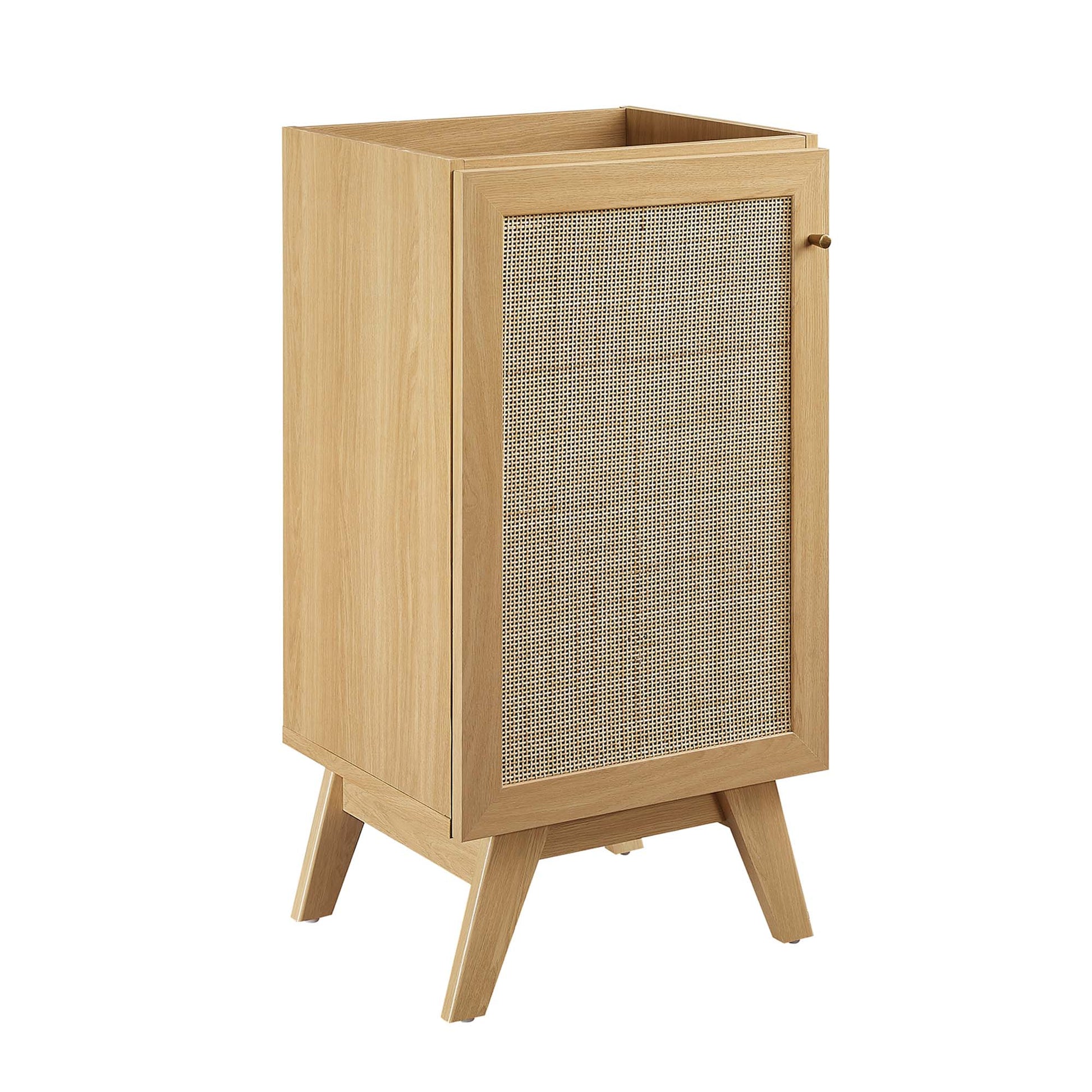Light oak mid-century bathroom vanity cabinet on angled legs with a cane-woven front panel and single knob door.