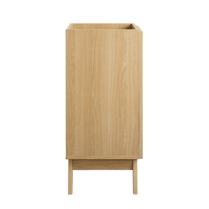 Oak-finish bathroom vanity cabinet (sink basin not included) with a front door in a minimalist mid-century style.