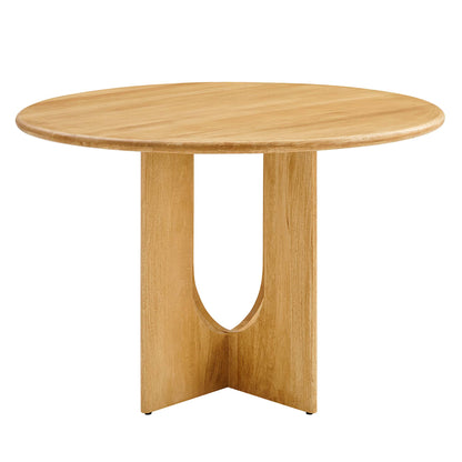 Round natural oak table with a sculpted U-shaped pedestal base and smooth edge.
