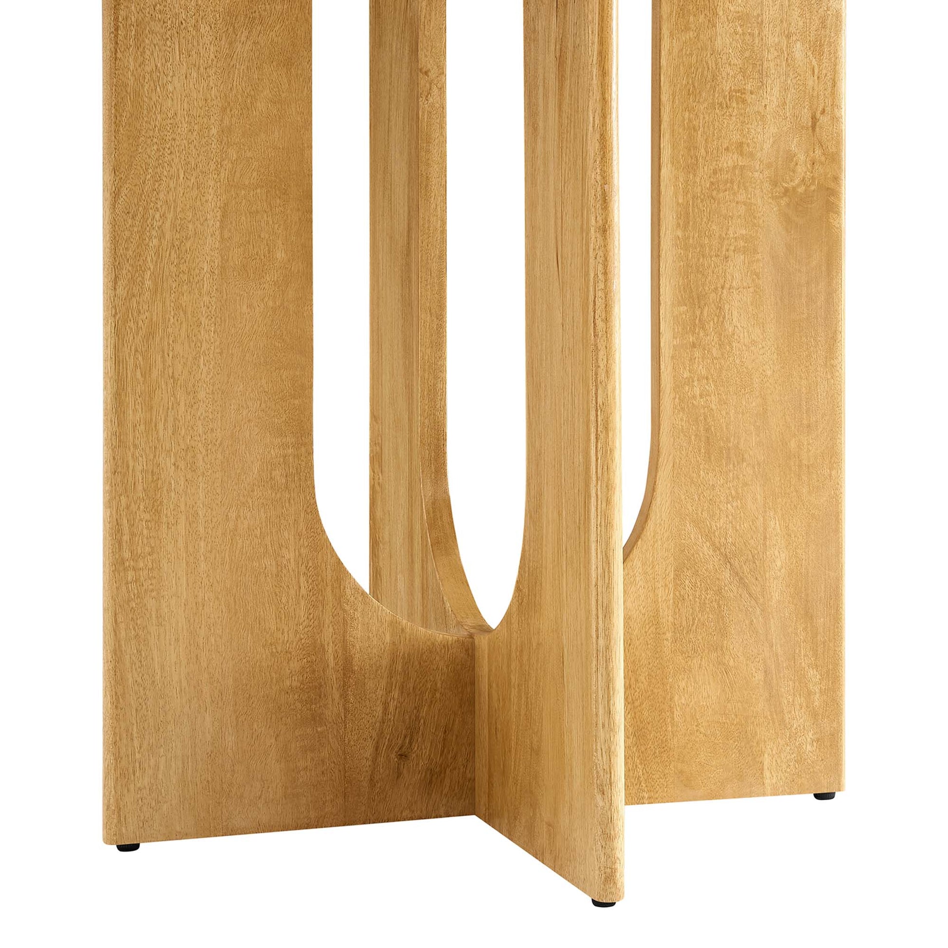 Oak wood round dining table with a curved, U-shaped base featuring cutouts and small feet, modern style.