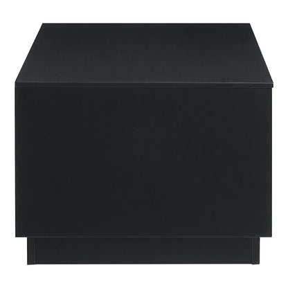 Black storage cube with lid, matte finish, modern square design; doubles as small table or ottoman.