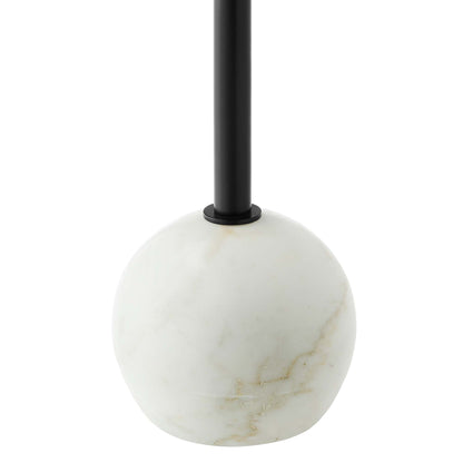 Round white marble top side table on a black metal frame.