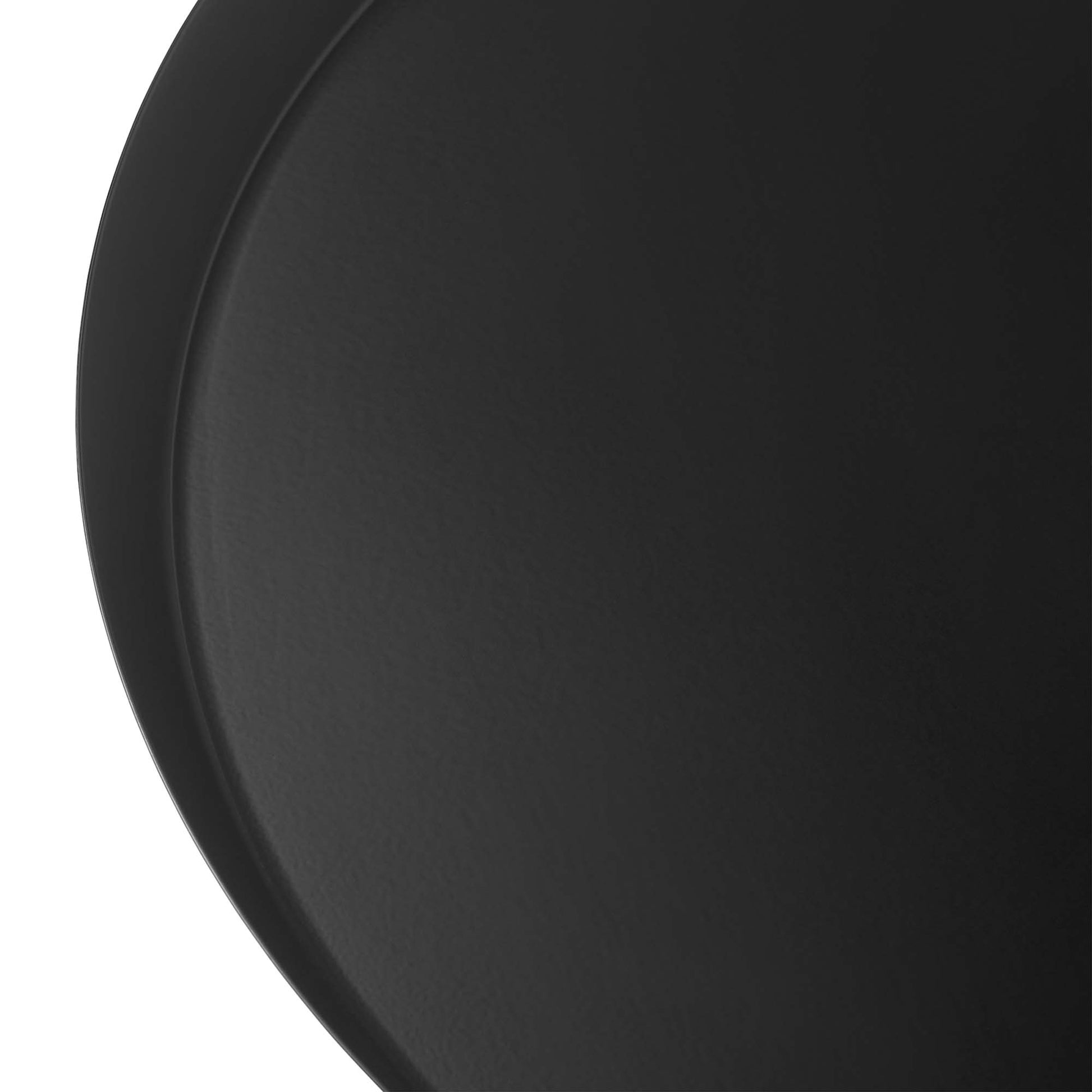 Circular black side table, partial view.