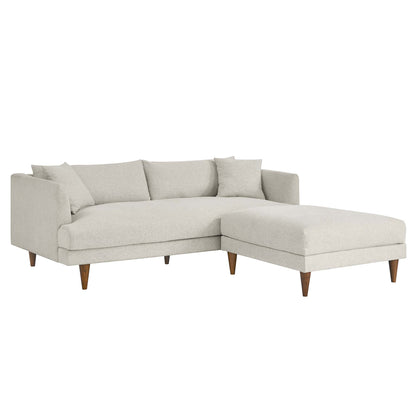 White fabric sectional sofa with chaise, mid-century wooden tapered legs, multiple cushions