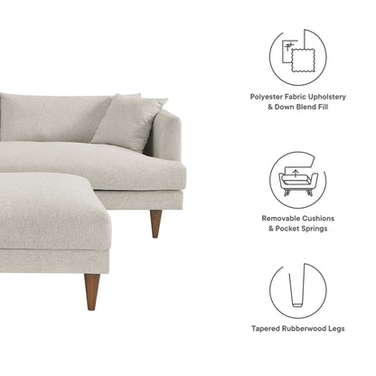Beige fabric sofa with chaise, removable cushions, and tapered rubberwood legs.