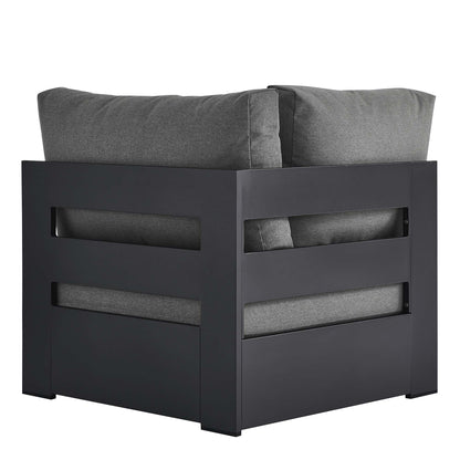 Dark charcoal outdoor modular corner chair with a powder-coated aluminum frame and gray cushions.