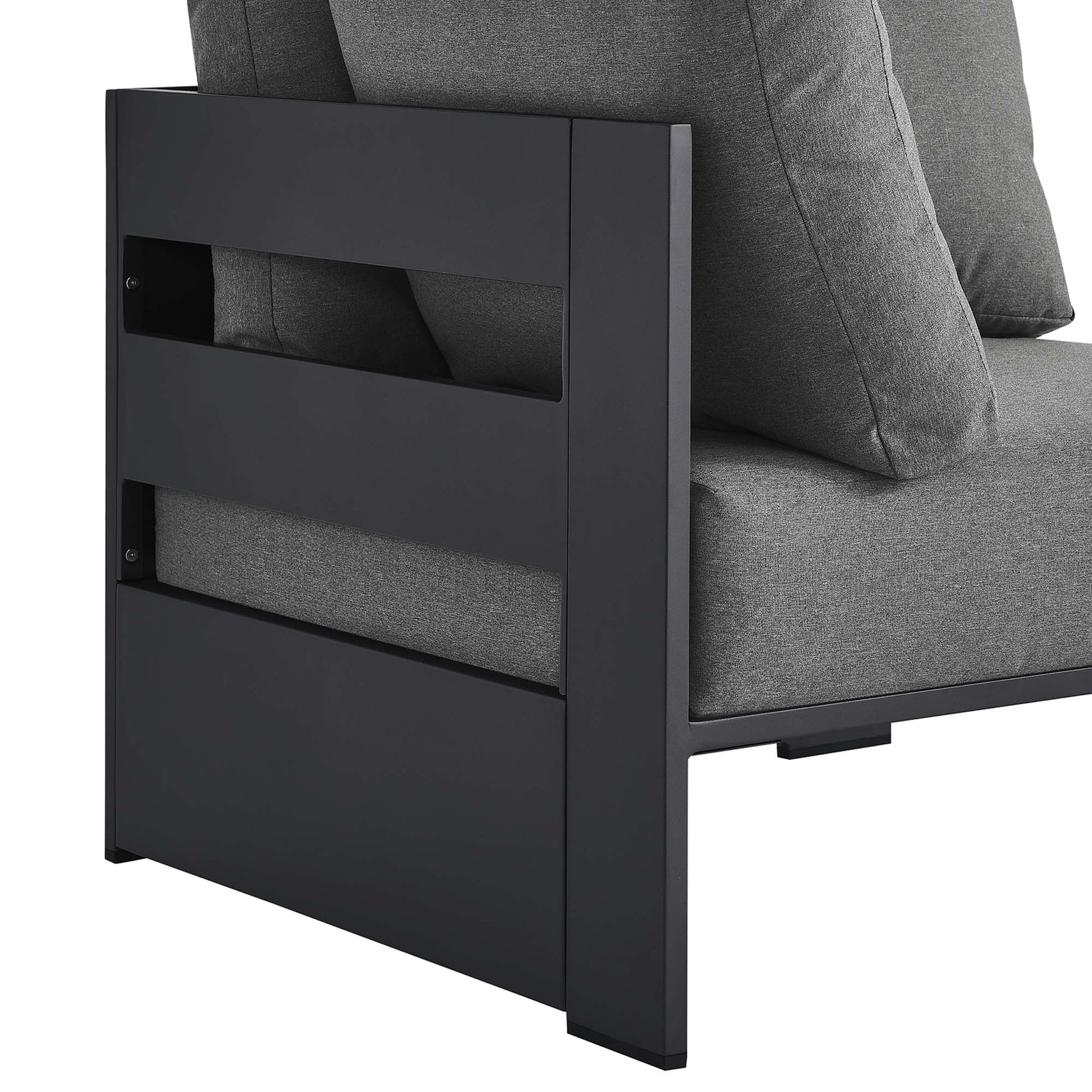 Dark metal frame lounge chair with charcoal gray cushions; slatted side panel and blocky modern design.