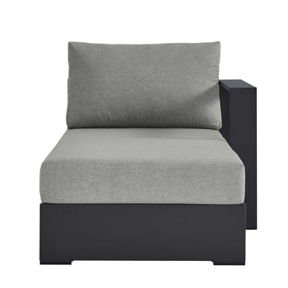 Gray cushioned chaise lounge with a powder-coated aluminum modular frame and rectangular side-panel arm, right-facing outdoor seating.
