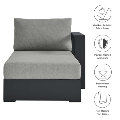 Grey cushioned chaise lounge with dark powder-coated aluminum frame; weather-resistant fabric and dense foam padding.