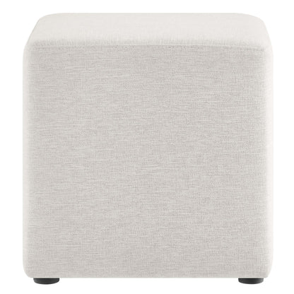 White fabric upholstered cube ottoman with small black feet, soft corners, versatile footrest or stool.