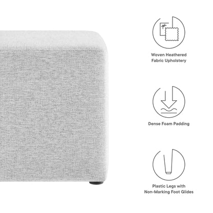 Light gray woven fabric upholstered ottoman, 17" square, with rounded corner, dense foam padding and plastic non-marking foot glides.