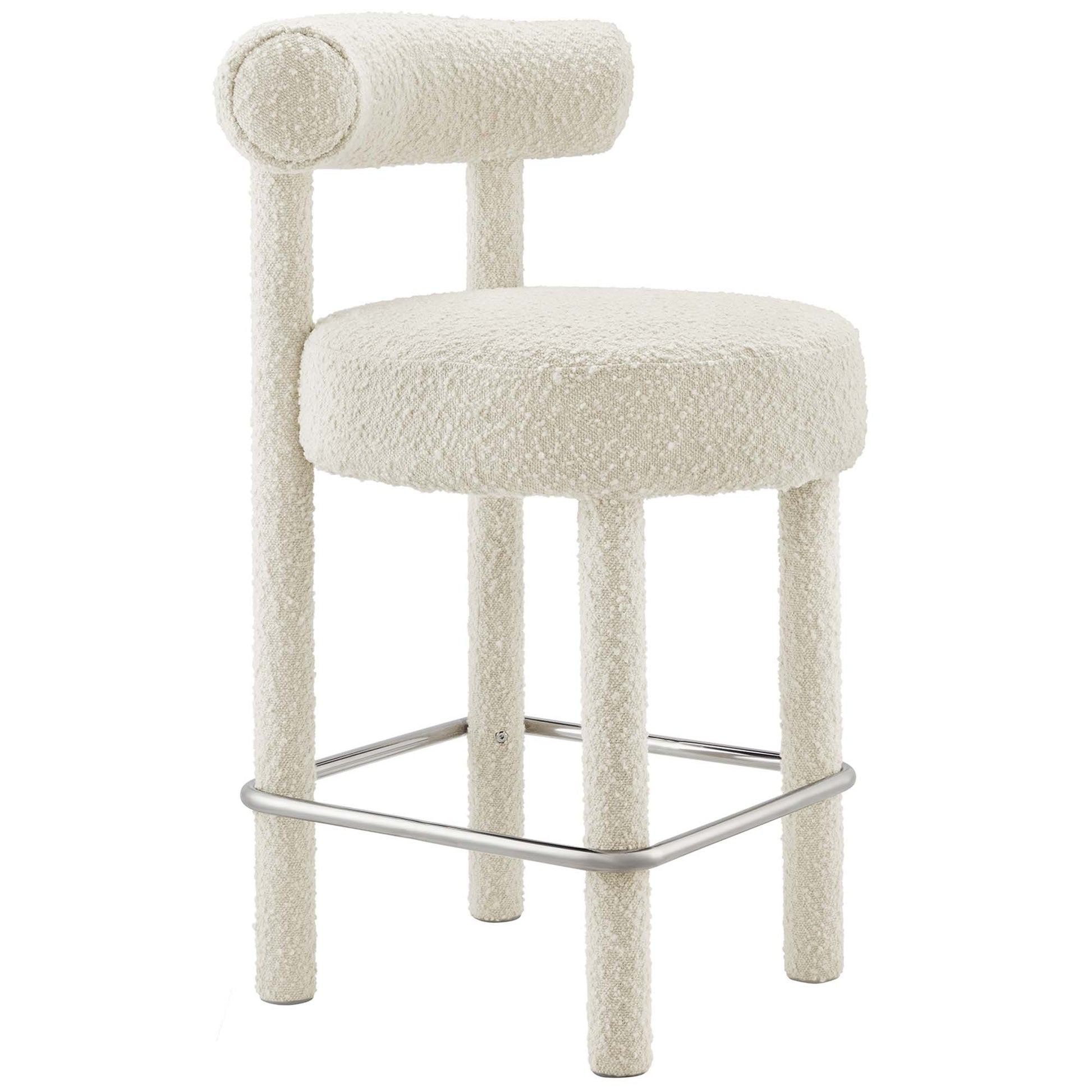 Ivory boucle bar stool with round padded seat, cylindrical back roll, four legs and chrome footrest.