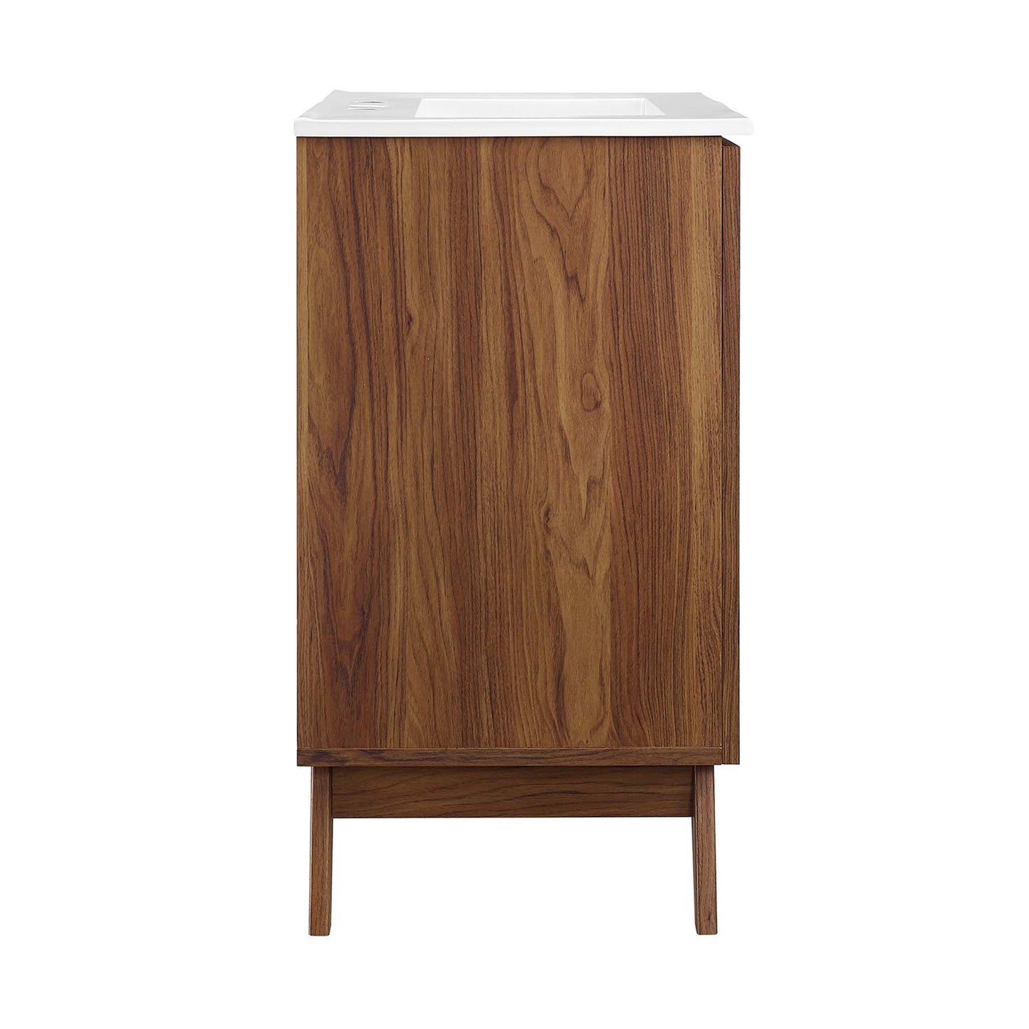 Walnut veneer bathroom vanity with white countertop and tapered mid-century legs.