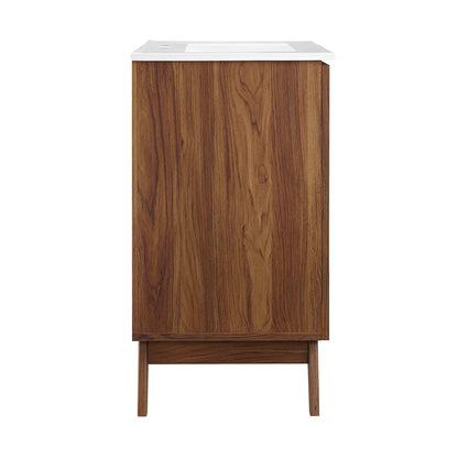 Walnut veneer bathroom vanity with white countertop and tapered mid-century legs.