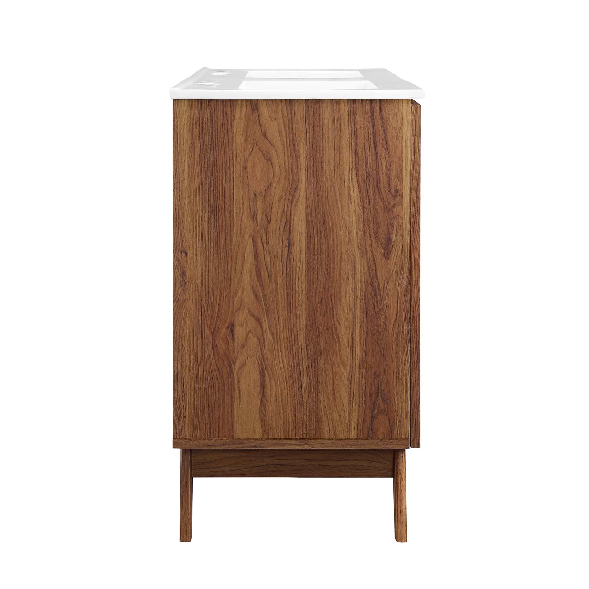 Walnut wood veneer bathroom vanity with white countertop, mid-century modern storage on tapered legs.