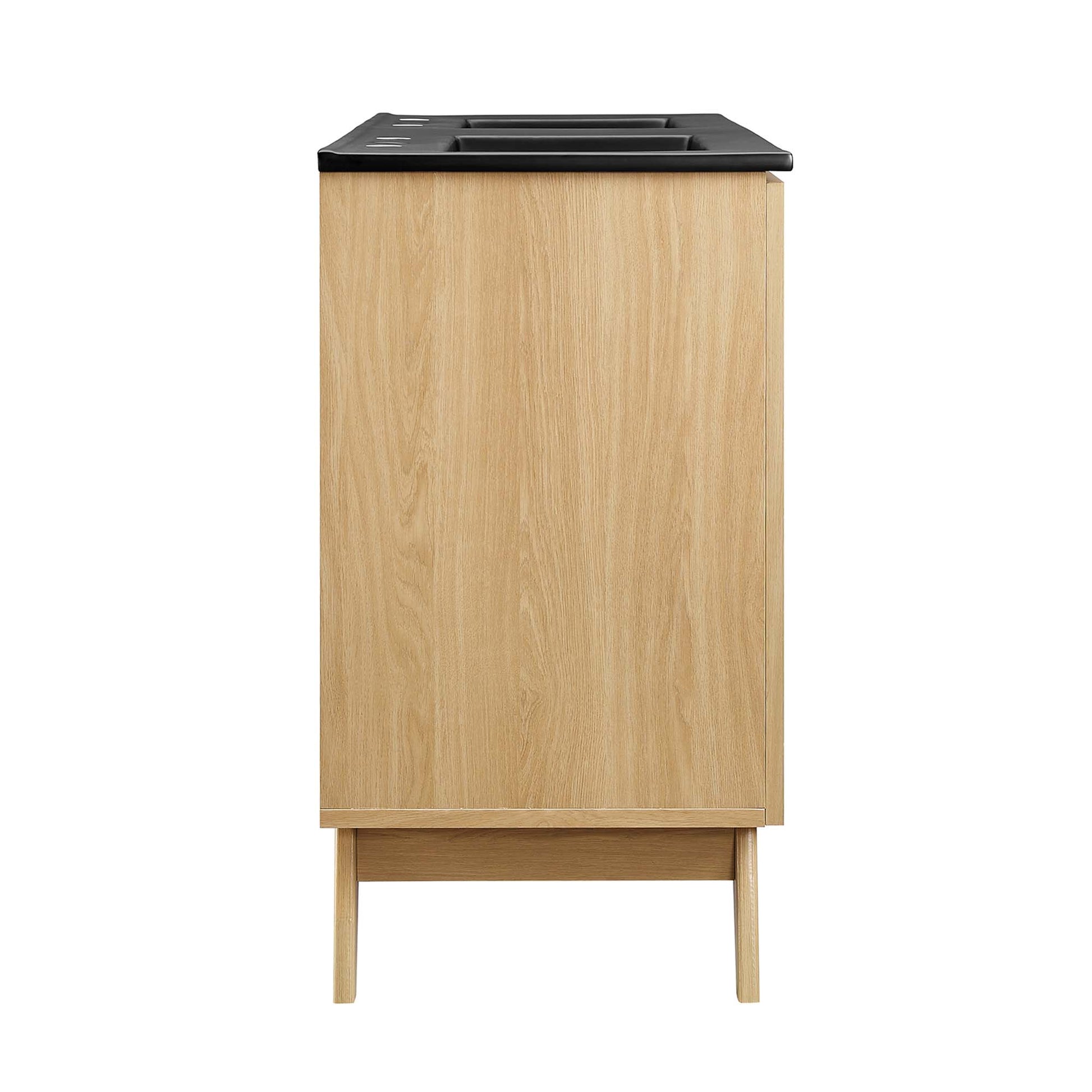 Oak wood cabinet with black top, slim rectangular vanity-style storage on short legs.
