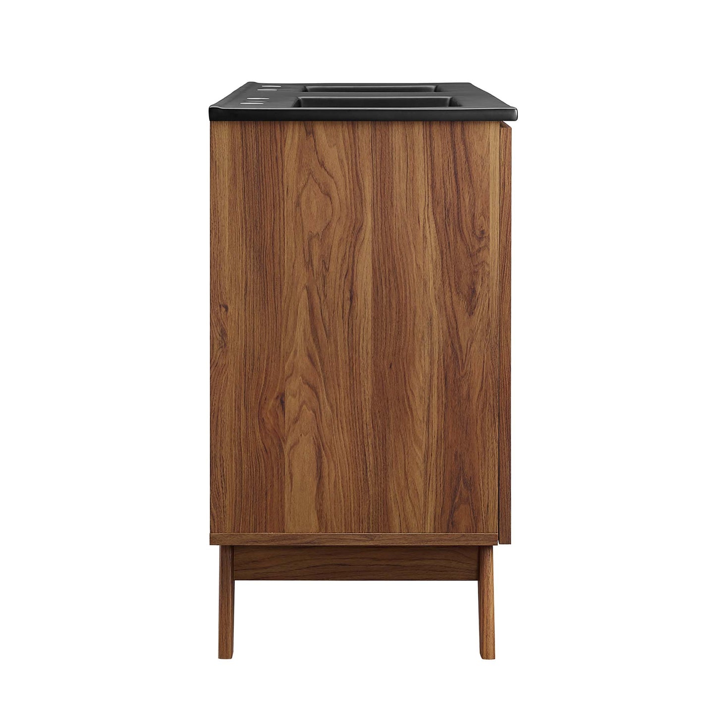 Walnut wood veneer bathroom vanity with black countertop, dual sinks and storage cabinets on mid-century legs.