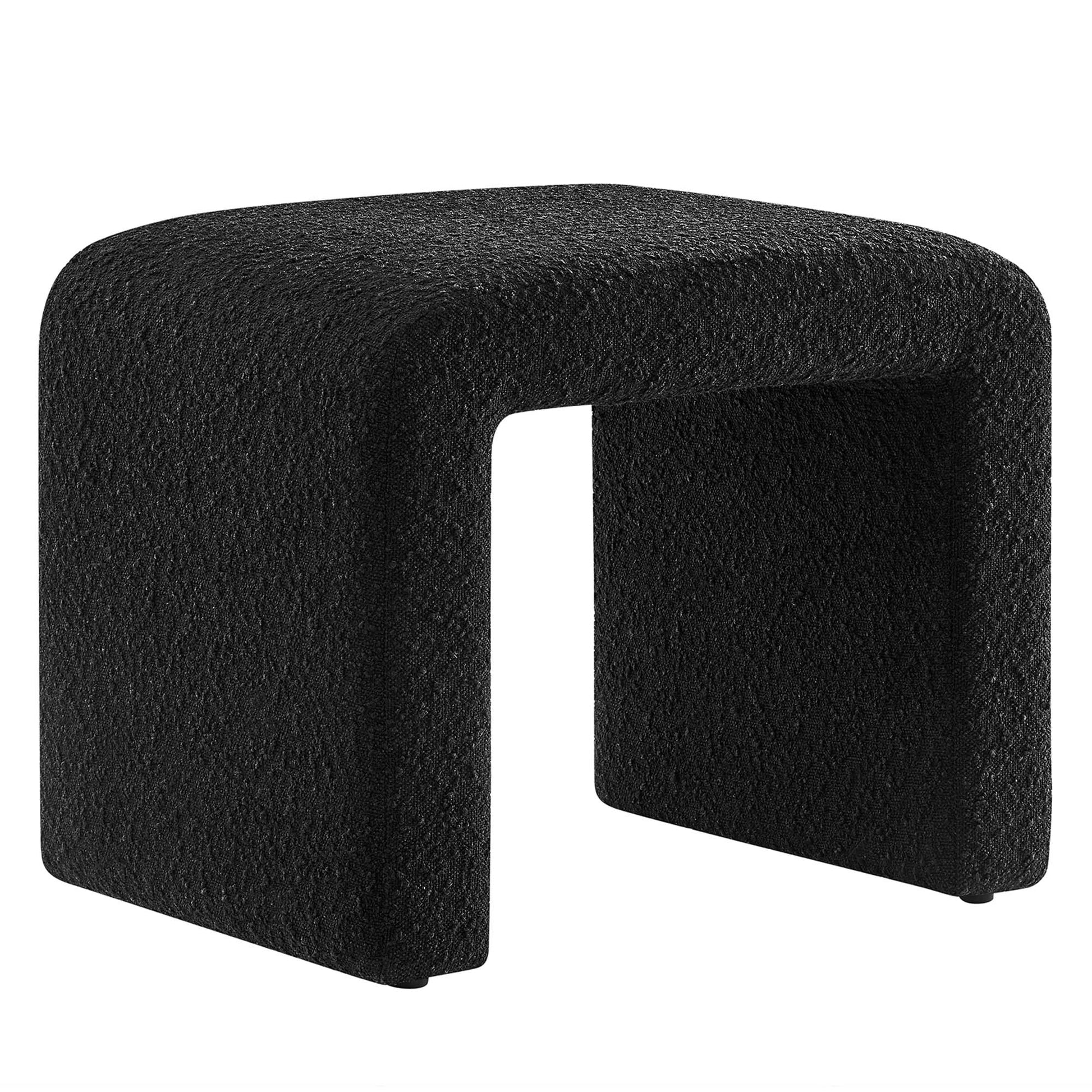 Black textured U-shaped ottoman footstool with hollow center for modern seating.