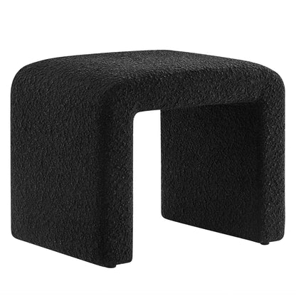 Black textured U-shaped ottoman footstool with hollow center for modern seating.