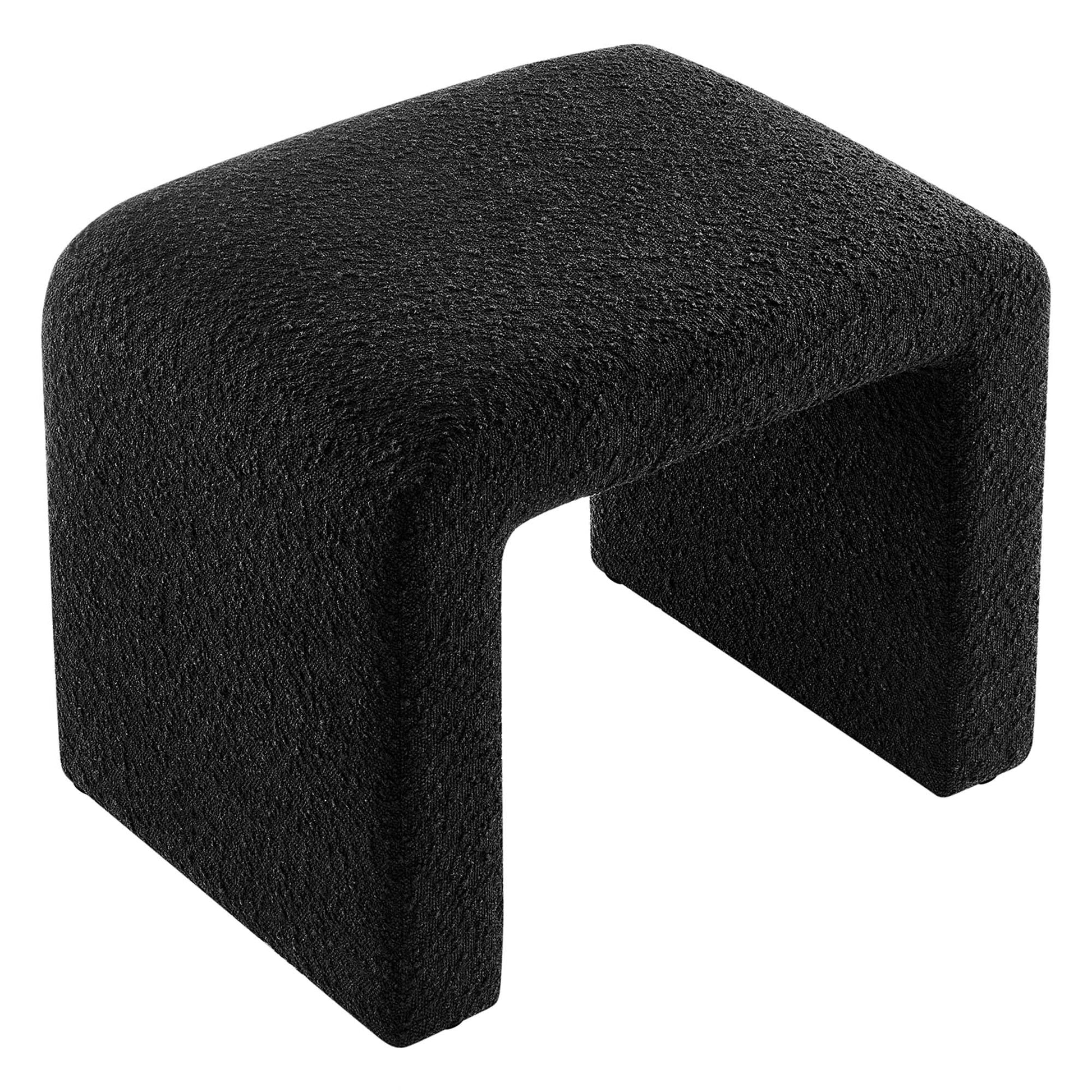 Black boucle fabric waterfall stool with a rounded cushioned seat.