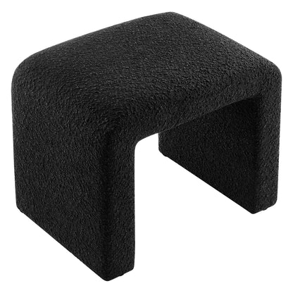 Black boucle fabric waterfall stool with a rounded cushioned seat.