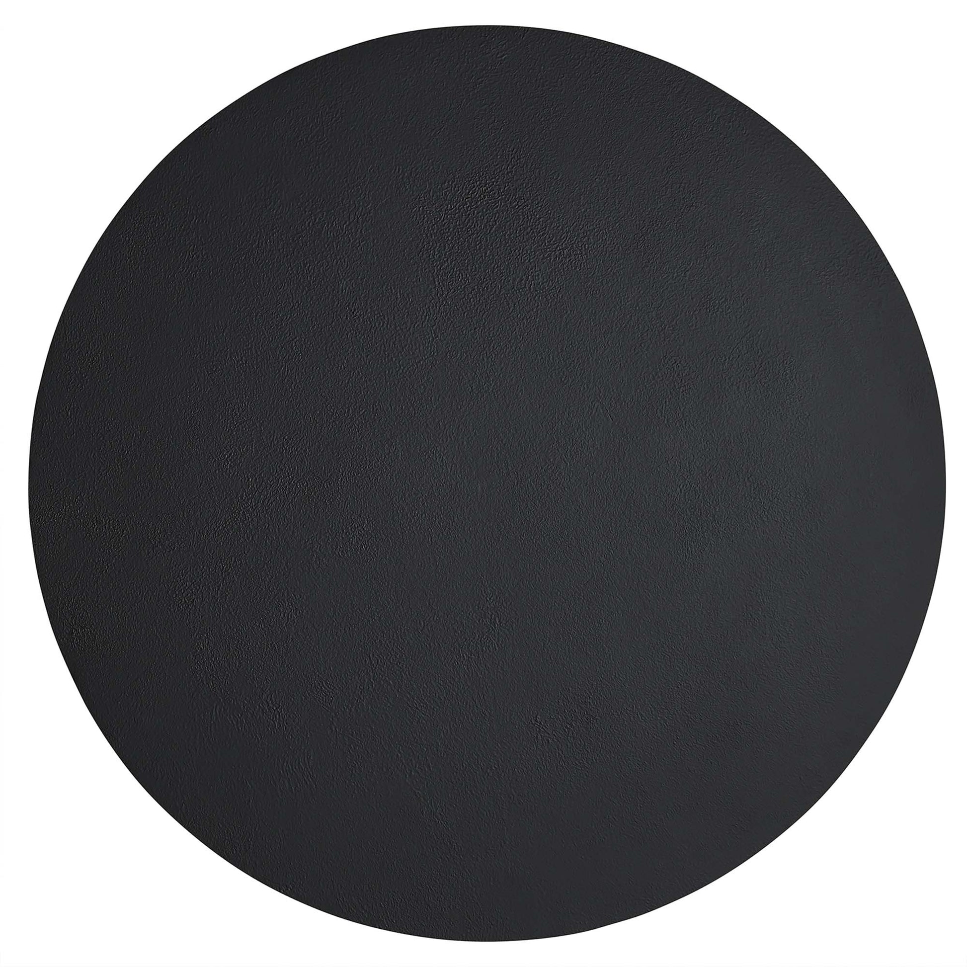 Round black concrete coffee table with matte finish.