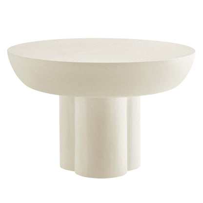 White round concrete coffee table with three cylindrical legs, modern minimalist design.