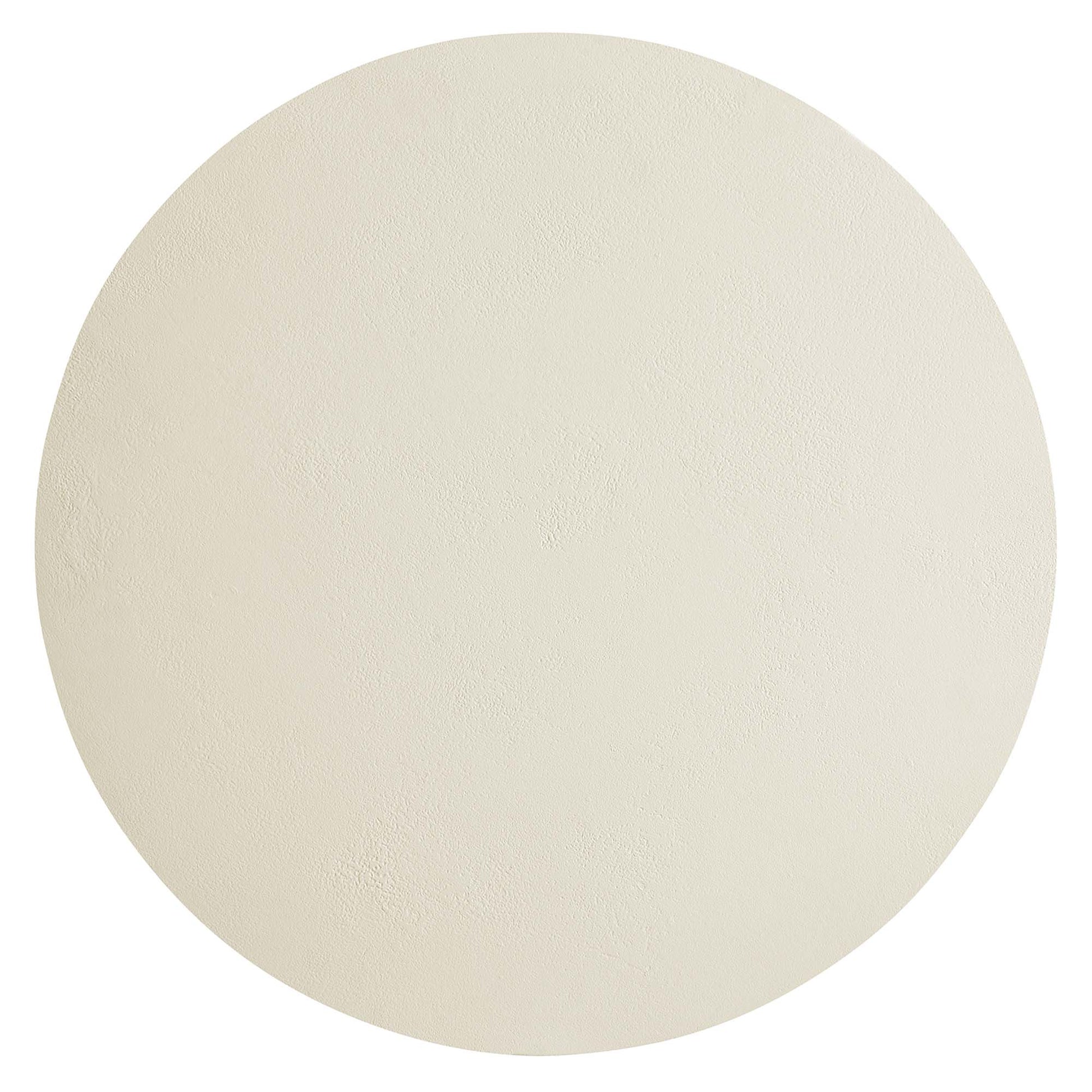 White round concrete coffee table with smooth edge and subtle textured surface.