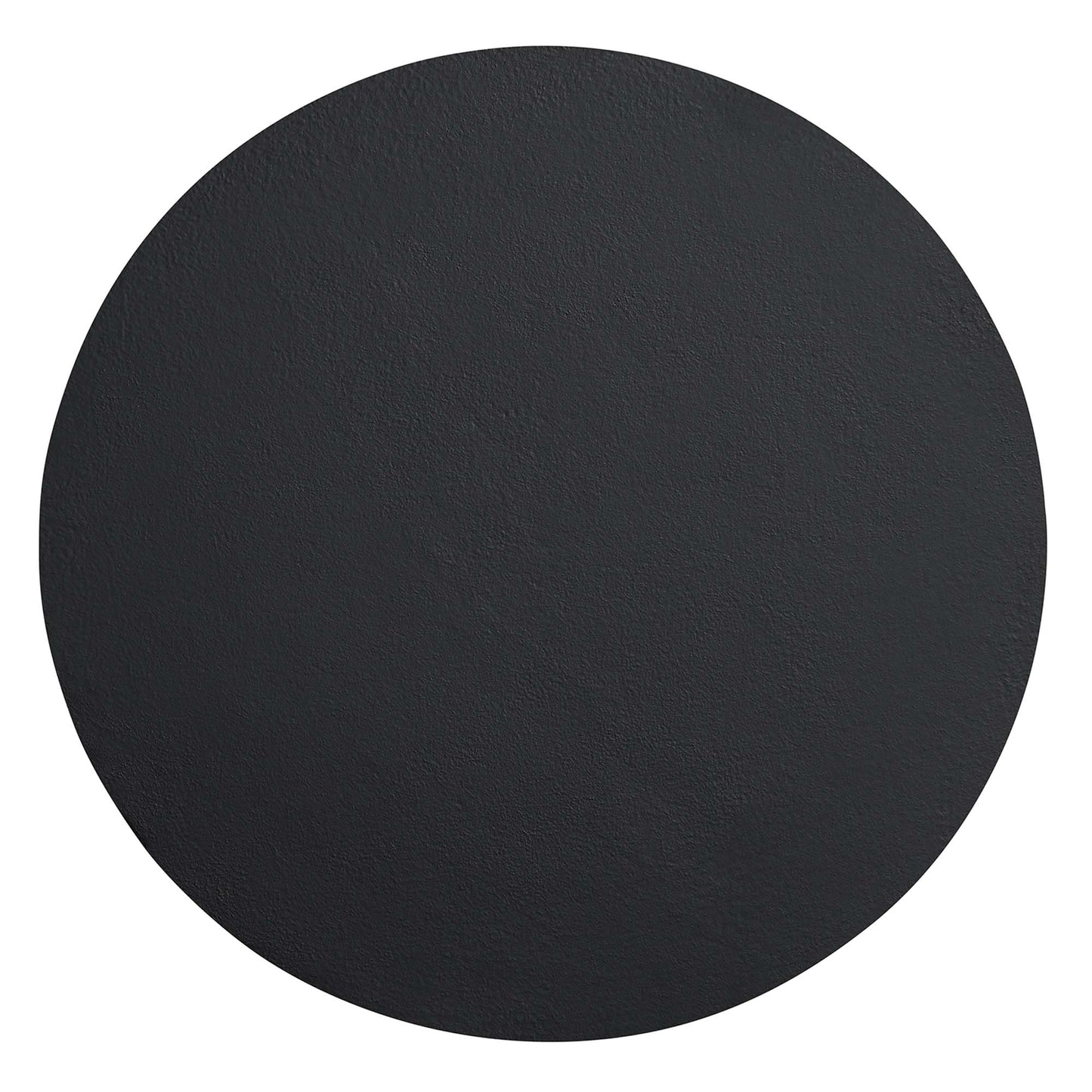 Round black concrete side table with a textured surface