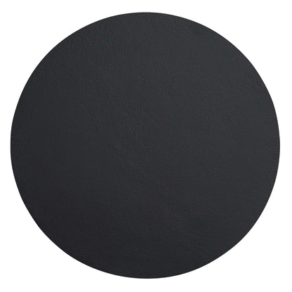 Round black concrete side table with a textured surface