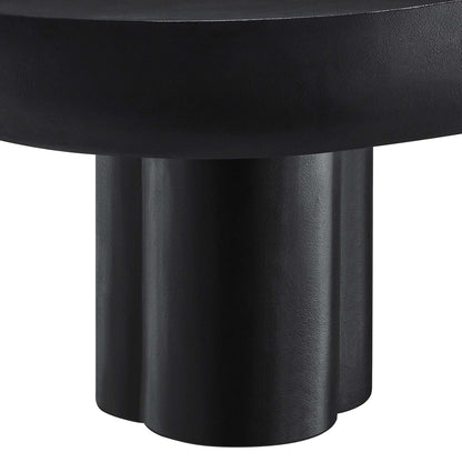 Close-up of a black matte metal pedestal base with three rounded columns supporting an oval concrete coffee table top.
