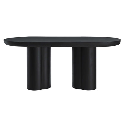 Black oval concrete dining table, 72 inches long, with two chunky cylindrical pedestal legs, modern minimalist design.
