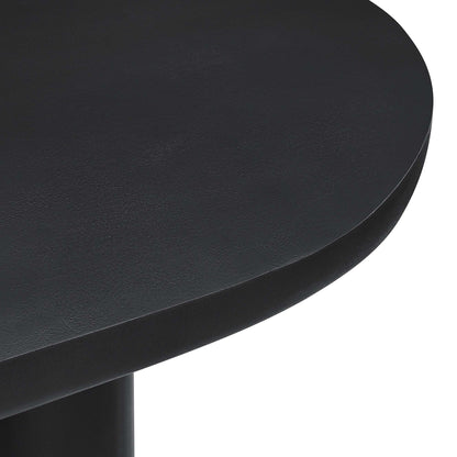 Black 72" oval concrete dining table with a pedestal base; smooth rounded edges visible.