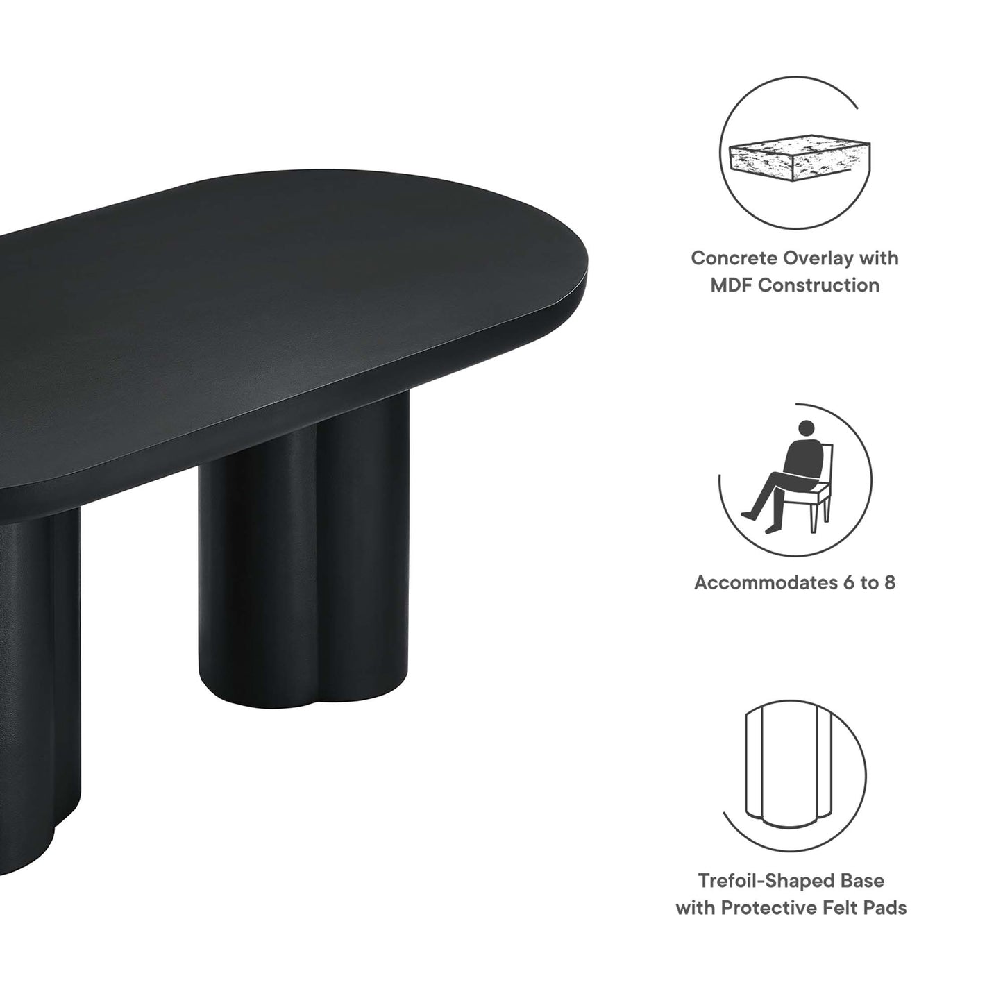 Black oval dining table with a trefoil base and felt pads; concrete overlay on MDF, seats 6–8.