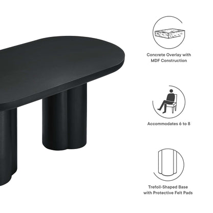 Black oval dining table with a trefoil base and felt pads; concrete overlay on MDF, seats 6–8.