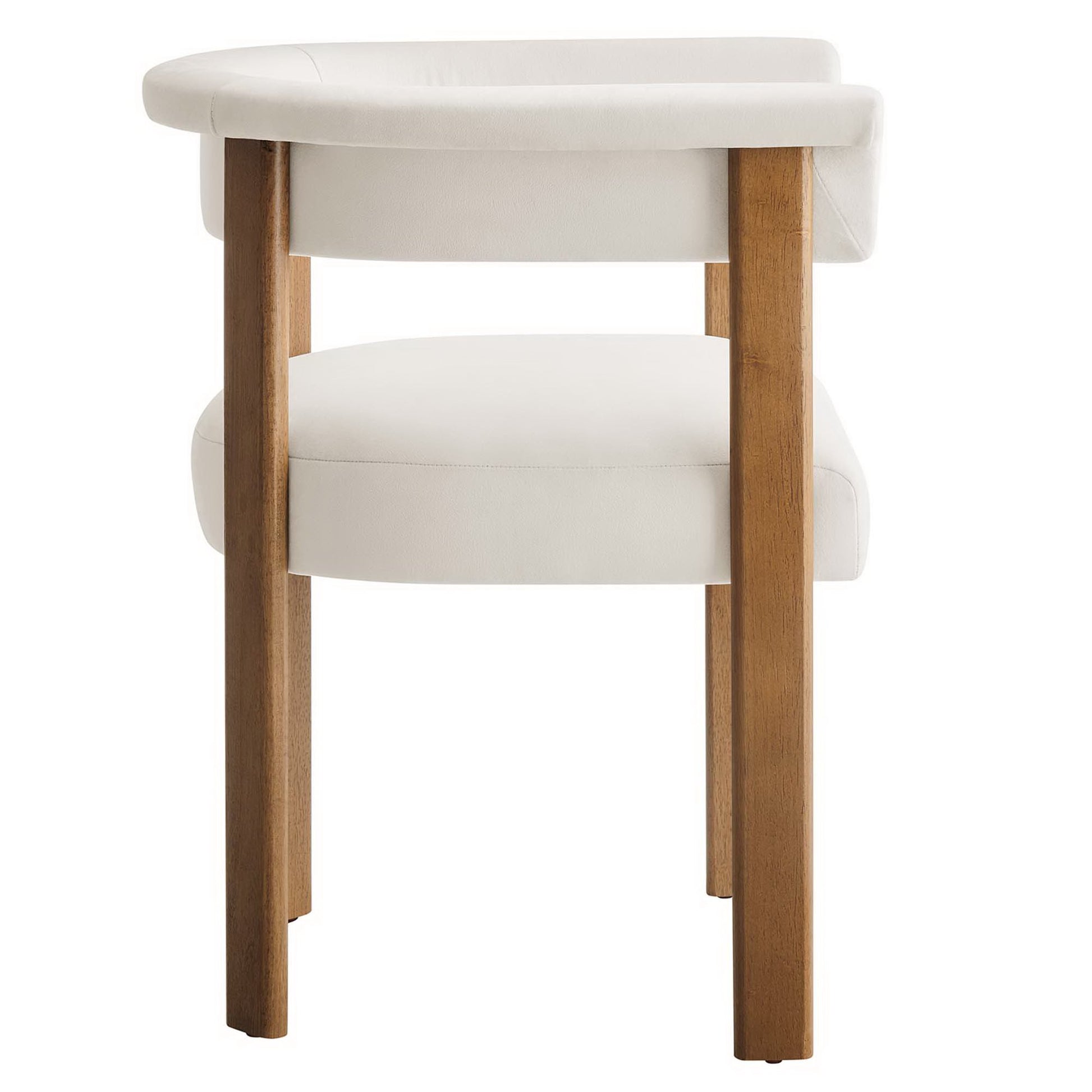 Two white velvet barrel dining chairs with rounded backs and wooden legs.
