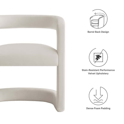 Beige velvet dining chair with barrel back, curved arms, stain-resistant upholstery, dense foam padding.